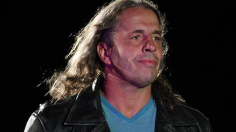 Bret Hart acting as referee in the ring at a wrestling event in 2011