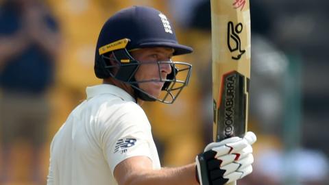 England batsman Jos Buttler raises his bat to acknowledge the crowd after reaching fifty against Sri Lanka