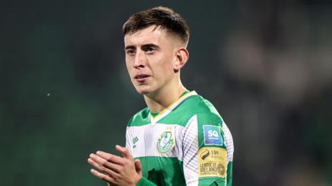 Darragh Burns standing on the pitch during a game for Shamrock Rovers