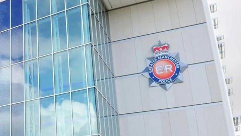 The front of GMP HQ which is partly all glass with white panels which have the force logo on them.