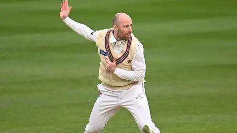 Jack Leach bowls