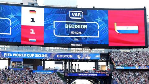 Big screen showing VAR at Germany v Paraguay