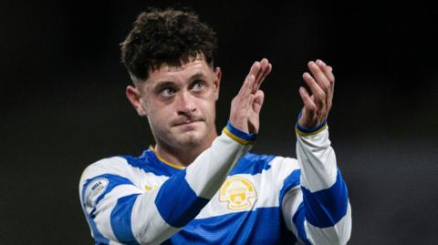 Michael Garrity applauds Morton fans