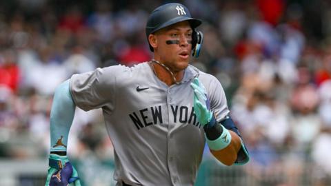  Aaron Judge #99 of the New York Yankees reacts after hitting a solo home run 