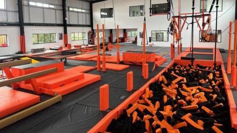 An orange and black gymnastics centre.