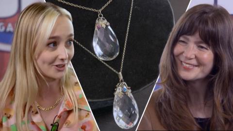 Auctioneer Hettie shows Bargain Hunt's presenter two necklaces with beautiful clear gems handing from intricate hand-crafted bail