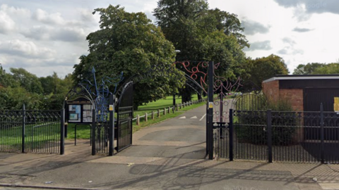 The Caludon Castle Park entrance from Farren Road with large black gates