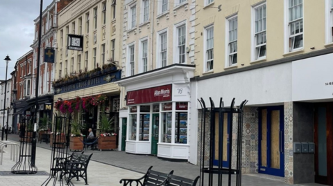 Some of the new tree protectors and benches, as well as stone paving, on High Street in Bromsgrove