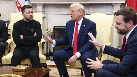 Ukranian President Volodymyr Zelensky, US President Donald Trump and Vice-President JD Vance seen seated on chairs in the Oval Office during a heated exchange