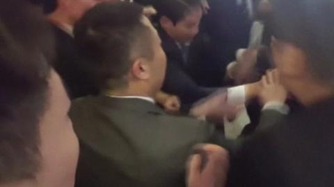 Image from a video of the altercation that left a South Korean photographer badly hurt