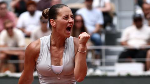 Marta Kostyuk fist-pumps in celebration