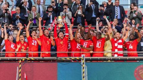 Whitstable Town FC lifting the FA Vase trophy