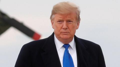 US President Donald Trump gives a thumbs up as he and first lady Melania Trump depart Joint Base Andrews in Maryland, 15 February 2019