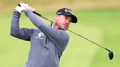 Brian Harman with his driver