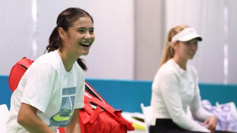 Emma Raducanu laughs during a training session for Great Britain at the Billie Jean King Cup in Malaga