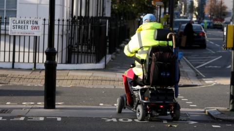 Man using mobility scooter