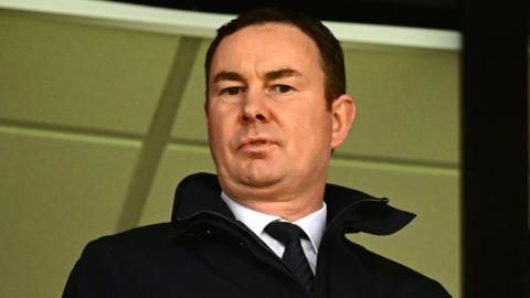 Derek Adams looks on
