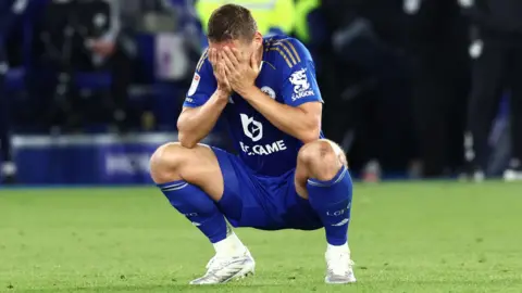Leicester City defender Jannik Vestergaard has his head in his hands at full-time