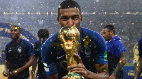 Kylian Mbappe with the World Cup in 2018