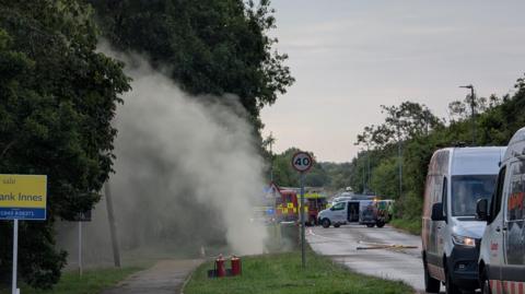 Gas rising into the air on Grantham Road, with a fire engine in the background