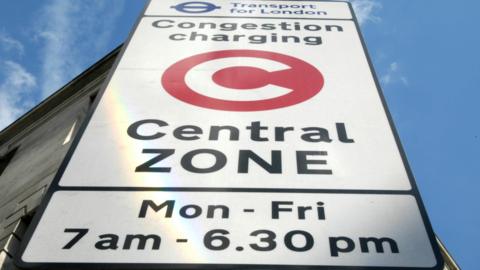 A sign shows a red circle with a large white C in it