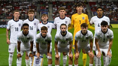 England players pose for a team group photo before their quarter-final match.