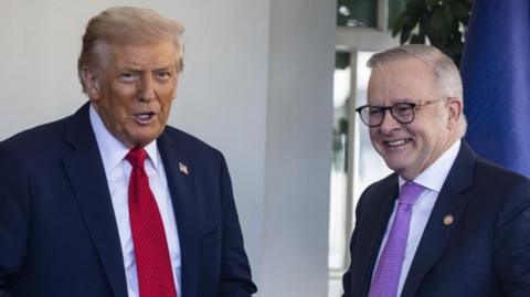 Donald Trump and Anthony Albanese smile and pose for photos outside the White House