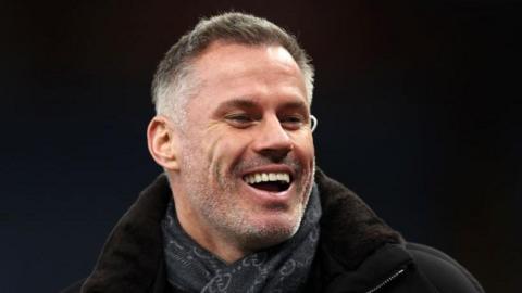 Jamie Carragher pictured laughing while working as a pundit
