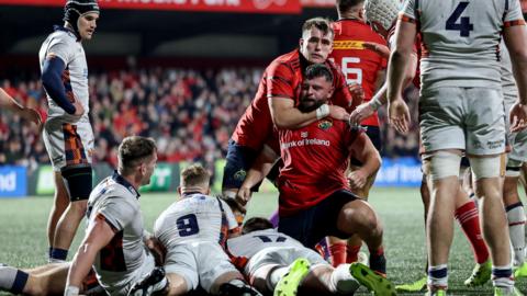 Munster's Michael Milne celebrates after scoring a try against Edinburgh