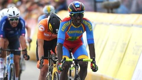 Eritrean cyclist Biniam Girmay crossing the line to win silver in the under-23 men's race at cycling's 2021 Road World Championships