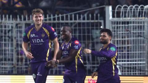 Kolkata Knight Riders' Cam Green (left) celebrates a wicket with Rovman Powell (centre) and Rinku Singh 