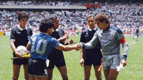Diego Maradona of Argentina (left) shakes hands with Peter Shilton of England ahead of the 1986 World Cup quarter-final. Referee Ali Bin Nasser is standing behind them along with two linesmen