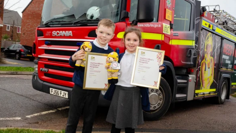 Harry and Grace stood in school uniform