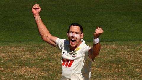 Australia bowler Scott Boland celebrates taking a wicket