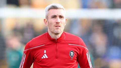 Salford City player-coach Matty Lund warming up for a match