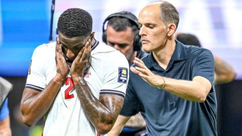Ezri Konsa of England and coach Thomas Tuchel of England gestures look dejected during the FIFA World Cup 2026 Semi Final match between England and Argentina at Atlanta Stadium on July 15, 2026 in Atlanta, United States.