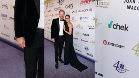 Harry (left) in a tuxedo next to Meghan (right) in a long black dress.