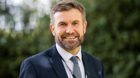 Kevin Gritton in a dark blue suit