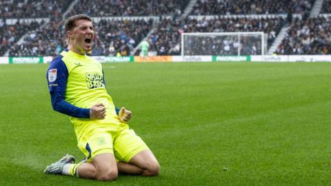 Alfie Devine celebrates his goal for Preston at Derby