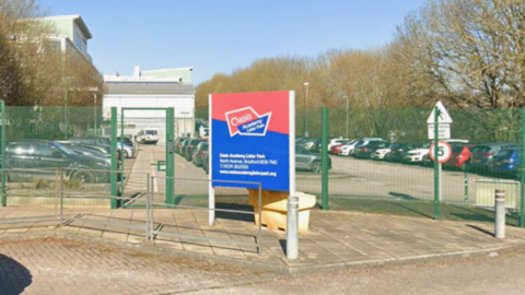  The entrance to a parking lot at Oasis Academy Lister Park