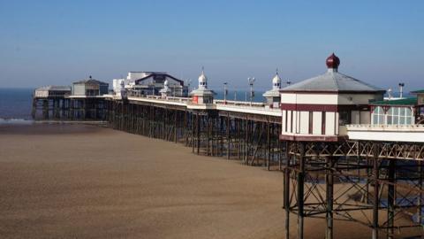 North Pier above the sands at Blackpool with the sea in the background
