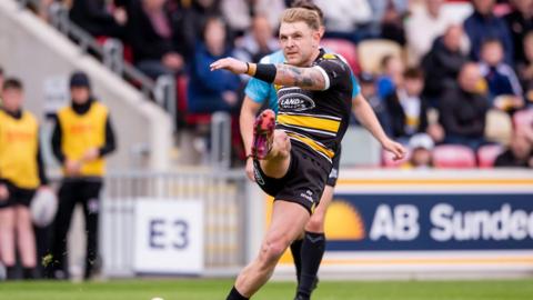York's Liam Harris kicks a conversion.