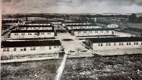 An image of the Biberach internment camp during the war showing blocks of buildings and fences. 