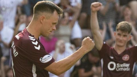 Lawrence Shankland celebrates after scoring a penalty for Hearts against Dunfermline Athletic