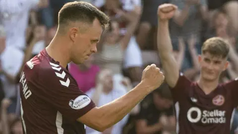 Lawrence Shankland celebrates after scoring a penalty for Hearts against Dunfermline Athletic
