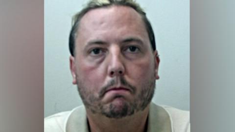 mugshot of Jamie Varley, who is wearing a cream polo shirt