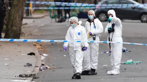 Forensic investigators at the scene in Friar Gate, Derby.