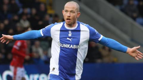 Joe Garner in action for Oldham against Crewe