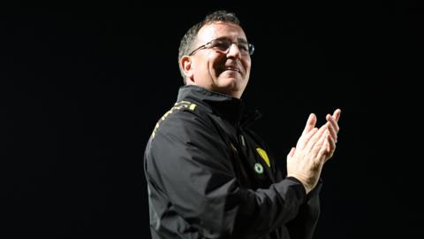 Burton boss Gary Bowyer applauding supporters