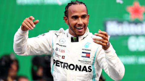 Lewis Hamilton celebrates after winning the Mexico Grand Prix